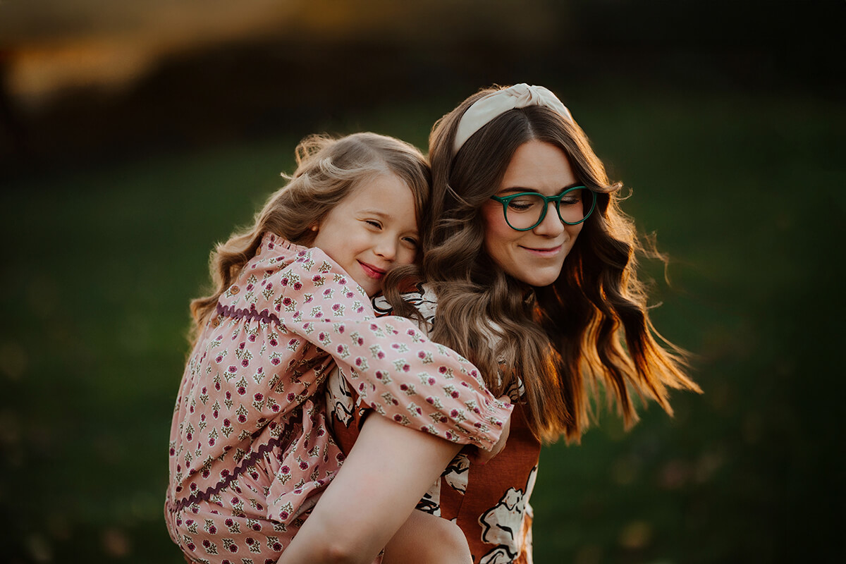 Candid moment with the Gauper family during a golden hour session West Michigan