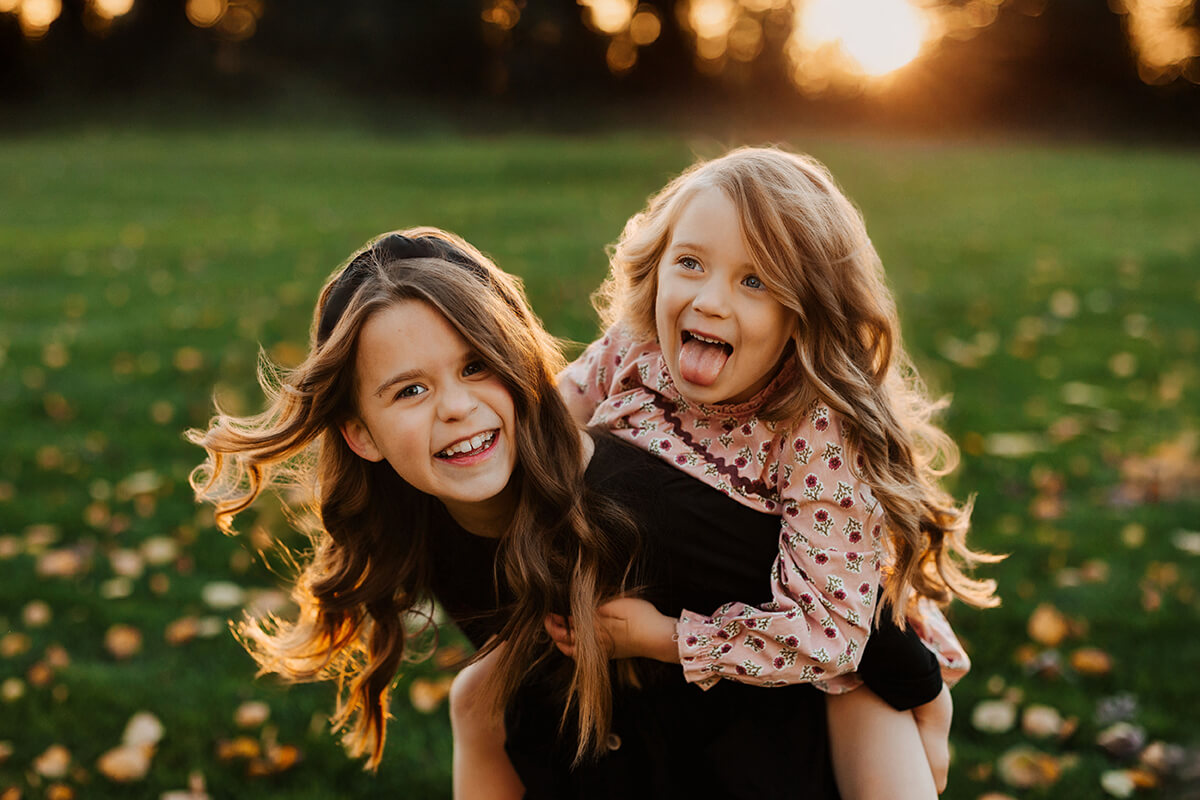 Ryan Gauper photographing his family at golden hour West Michigan GAUPERfamilies