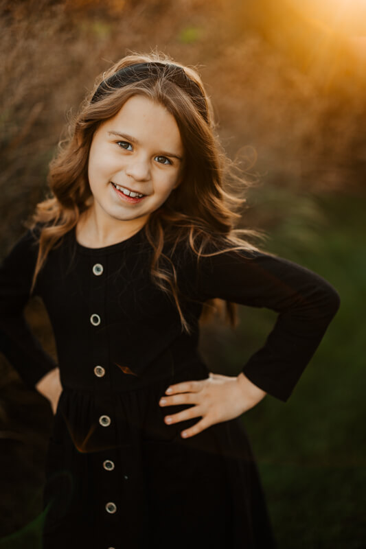 Holly Gauper and daughters smiling during a candid family session West Michigan