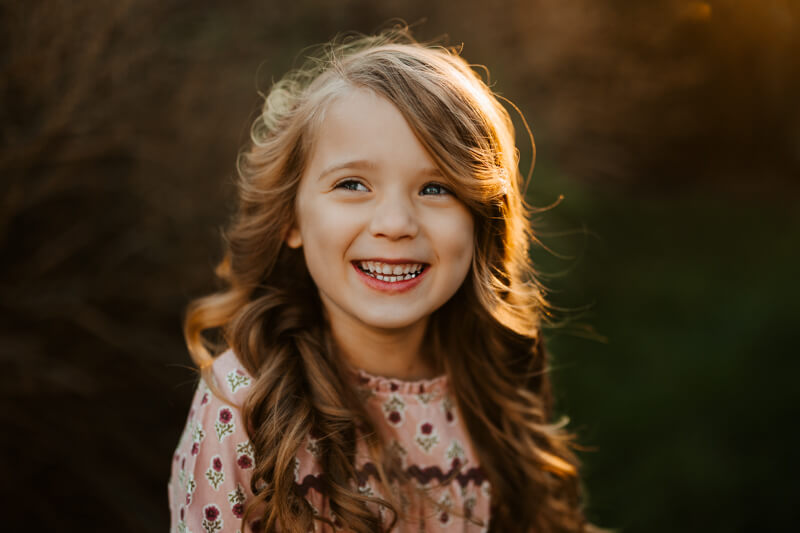 Ryan and Holly Gauper with their daughters during a candid family session West Michigan