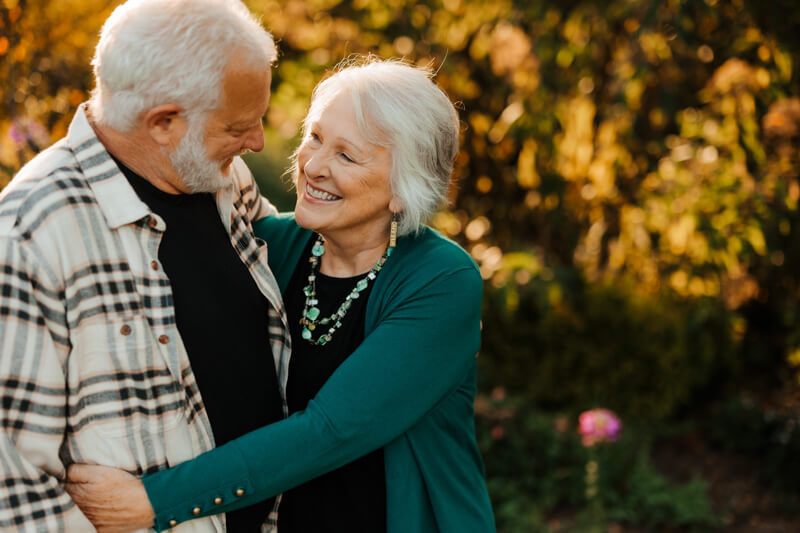 Grandparents sharing a joyful laugh together during extended family photography session West Michigan GAUPERfamilies